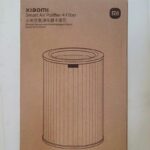 بسته‌بندی فیلتر تصفیه هوای Xiaomi مدل Air Purifier 4 کنار دستگاه